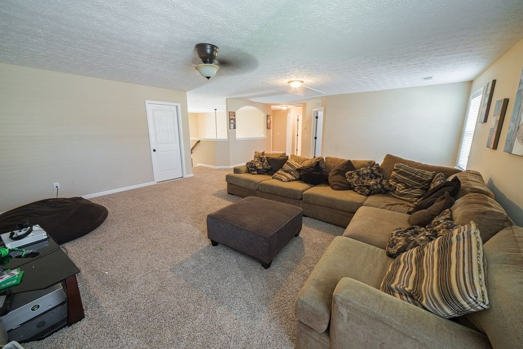 9570 Yarbrough Road Midland, GA 31820 - Photo 26 of 30 a living room with furniture and a ceiling fan