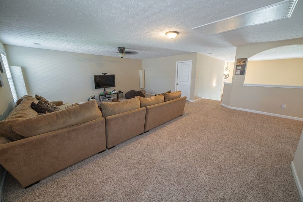 9570 Yarbrough Road Midland, GA 31820 - Photo 27 of 30 a living room with furniture and a lamp