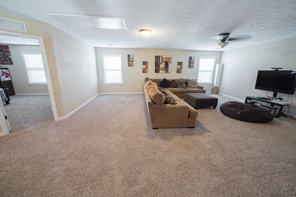 9570 Yarbrough Road Midland, GA 31820 - Photo 28 of 30 a living room with furniture and a flat screen tv