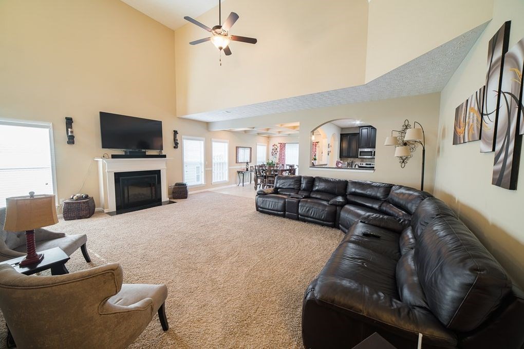 9570 Yarbrough Road Midland, GA 31820 - Photo 3 of 30 a living room with furniture fireplace and a flat screen tv
