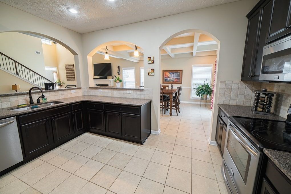 9570 Yarbrough Road Midland, GA 31820 - Photo 5 of 30 a kitchen with a sink and a stove top oven