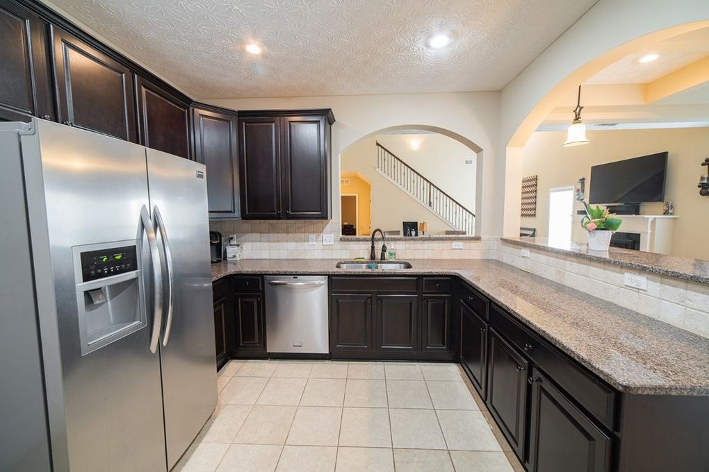9570 Yarbrough Road Midland, GA 31820 - Photo 7 of 30 a large kitchen with stainless steel appliances granite countertop a sink and a refrigerator