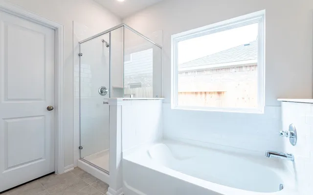 a white bath tub sitting next to a window