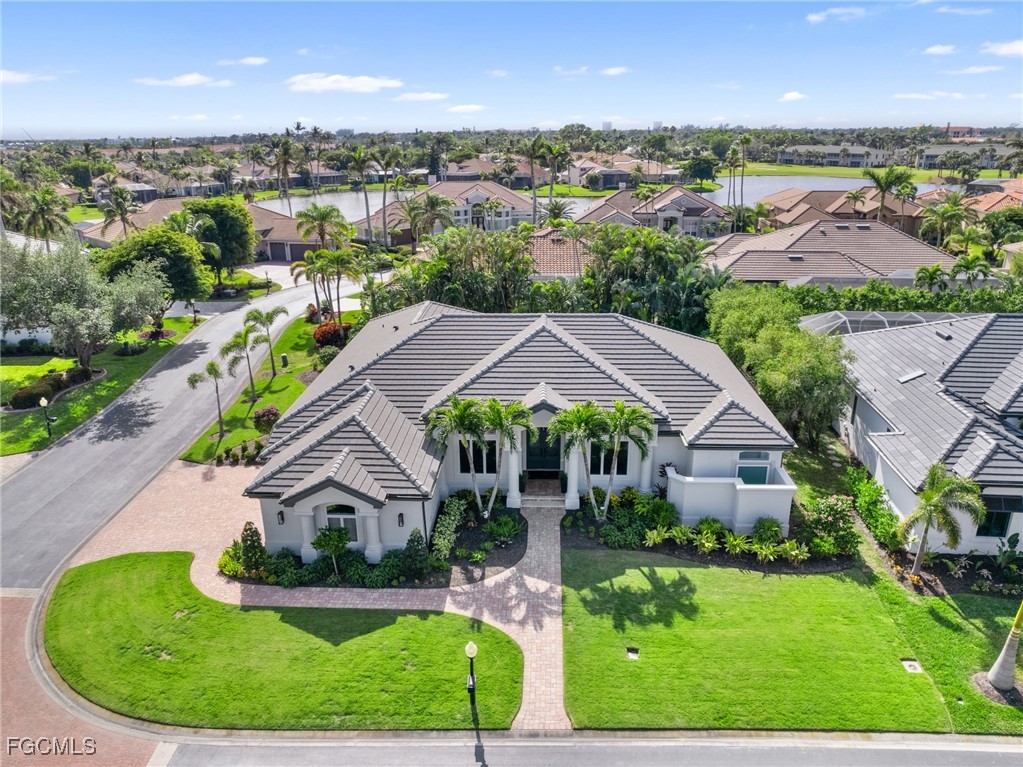 11451 Compass Point Drive Fort Myers, FL 33908 - Photo 1 of 47 an aerial view of residential houses with outdoor space and trees