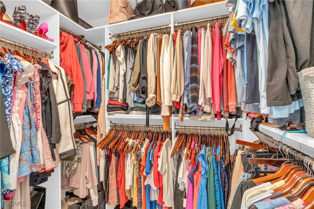 11451 Compass Point Drive Fort Myers, FL 33908 - Photo 27 of 47 a view of walk in closet with clothes