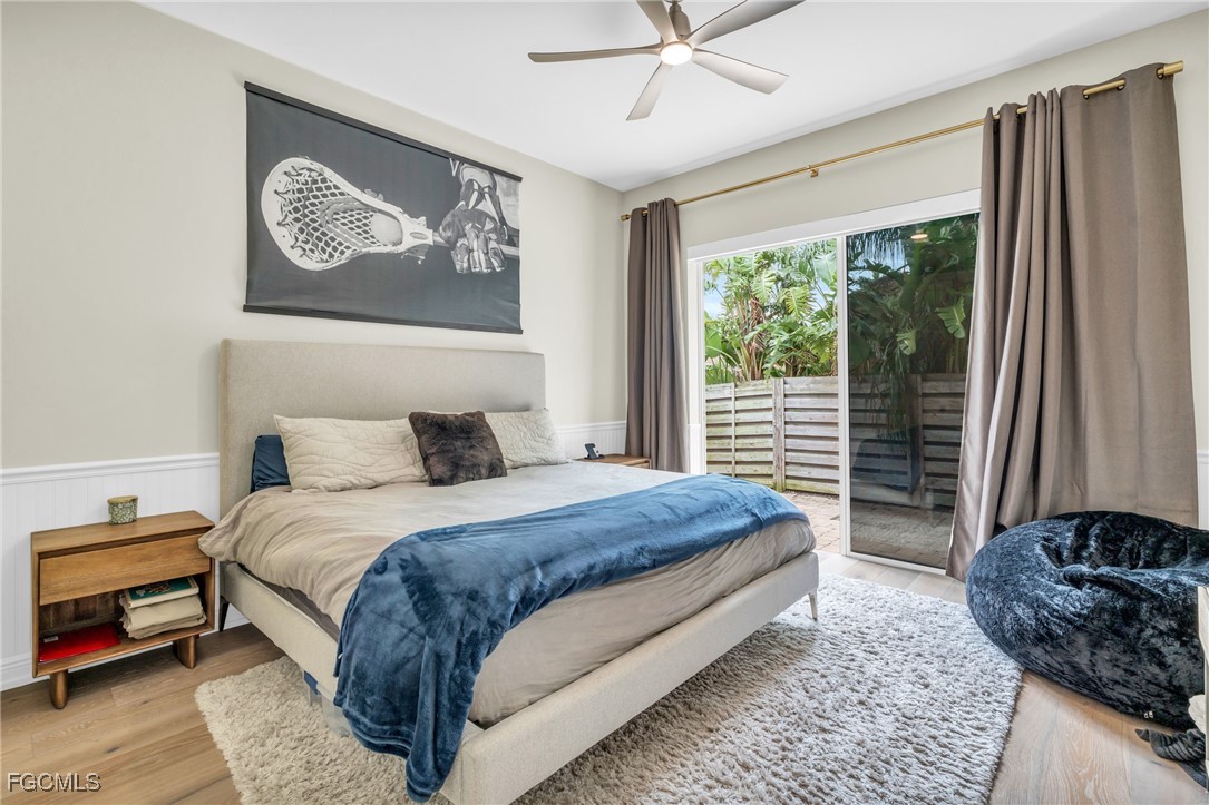 11451 Compass Point Drive Fort Myers, FL 33908 - Photo 31 of 47 a bedroom with a large bed and a window