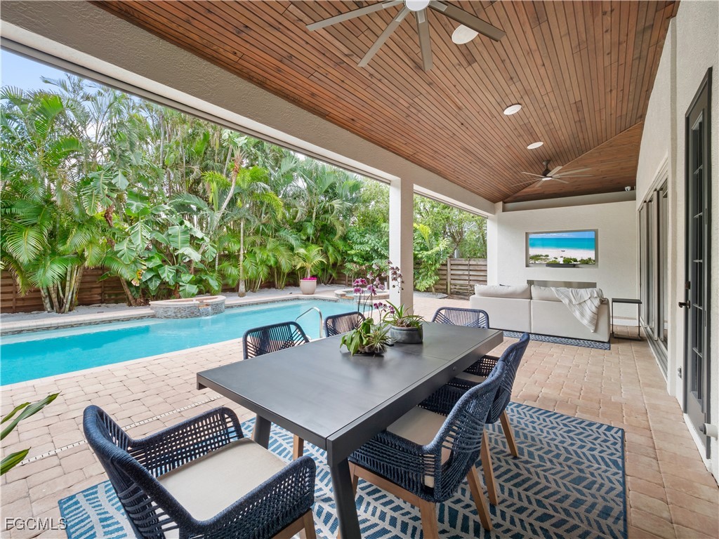 11451 Compass Point Drive Fort Myers, FL 33908 - Photo 36 of 47 a outdoor dining space with furniture and outdoor view