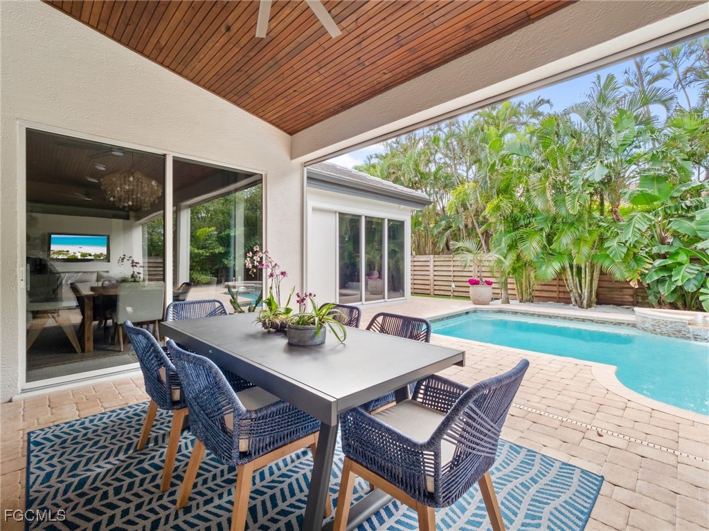 11451 Compass Point Drive Fort Myers, FL 33908 - Photo 41 of 47 a view of an outdoor dining space with a table and chairs