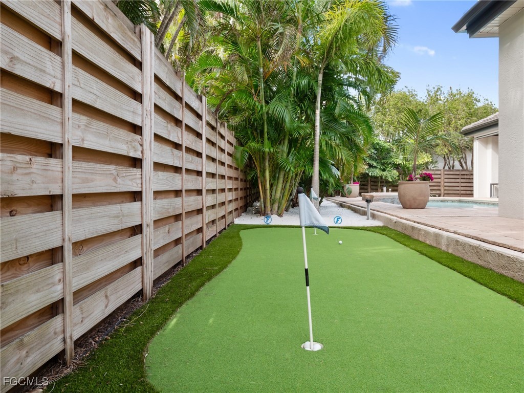 11451 Compass Point Drive Fort Myers, FL 33908 - Photo 42 of 47 a view of a house with a backyard