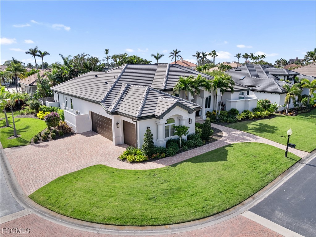 11451 Compass Point Drive Fort Myers, FL 33908 - Photo 46 of 47 a view of a house with a garden