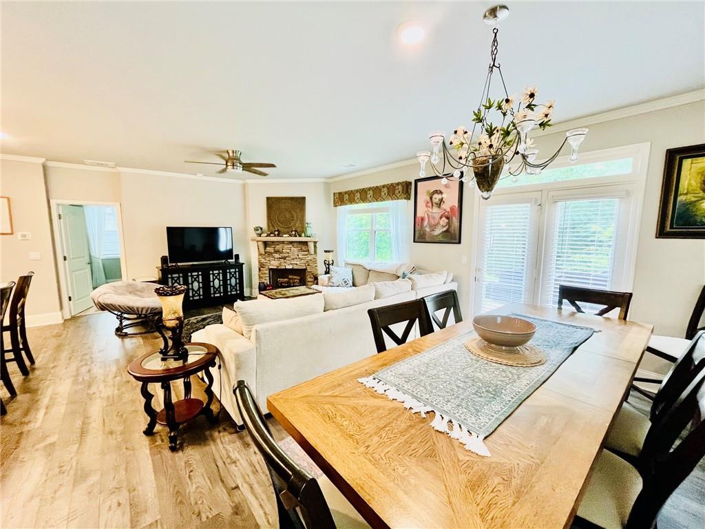 3015 Winding Ridge Waleska, GA 30183 - Photo 10 of 40 a living room with fireplace furniture and a chandelier