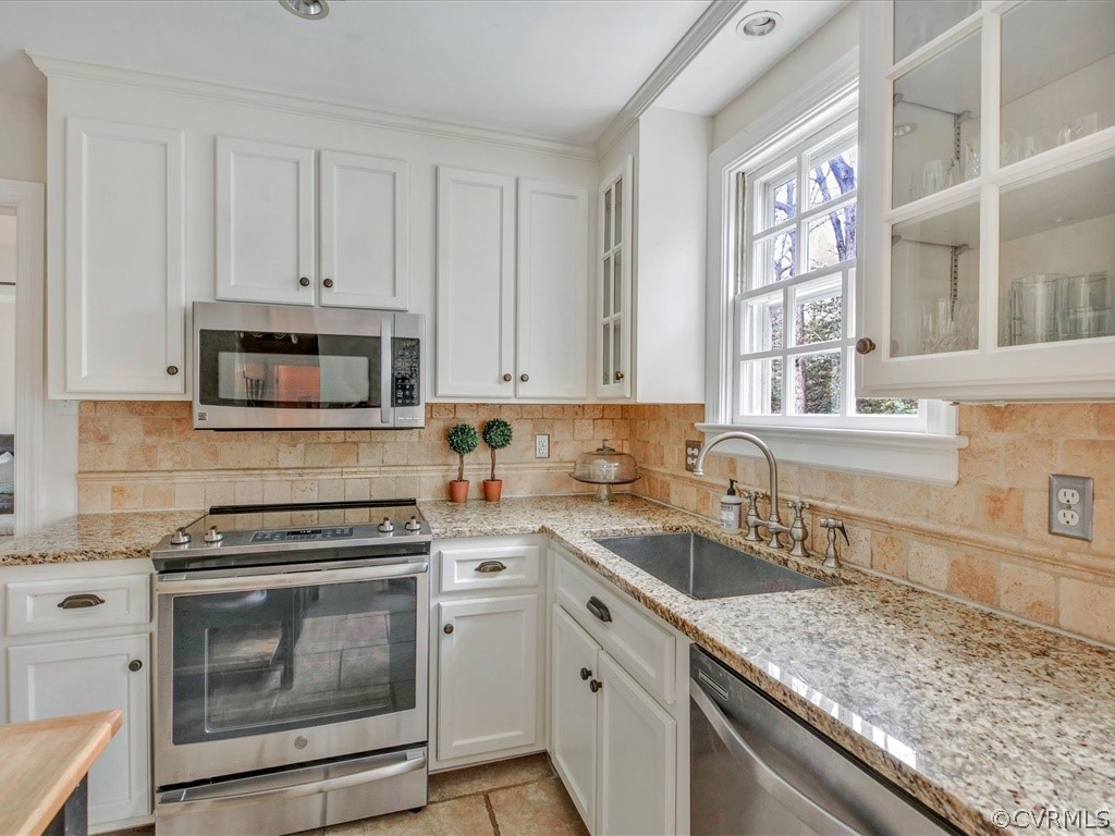 2100 Ramsgate Square Chesterfield, VA 23236 - Photo 12 of 36 a kitchen with granite countertop a stove sink and cabinets