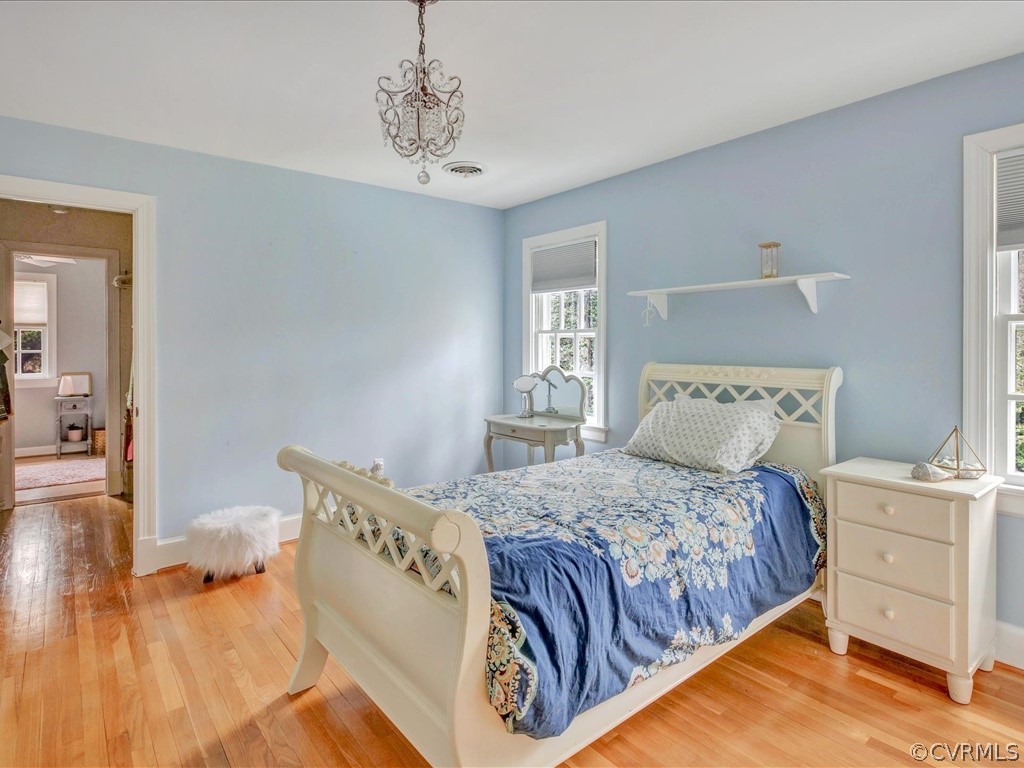 2100 Ramsgate Square Chesterfield, VA 23236 - Photo 28 of 36 a bedroom with a large bed and a chandelier
