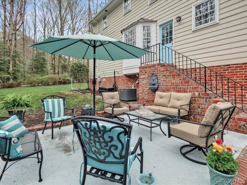 2100 Ramsgate Square Chesterfield, VA 23236 - Photo 33 of 36 a patio with a patio table and chairs