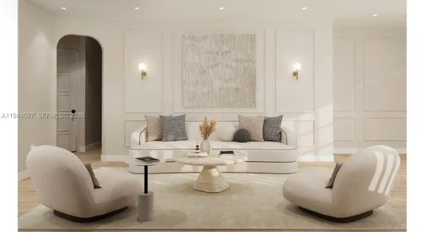 a living room with furniture and a potted plant