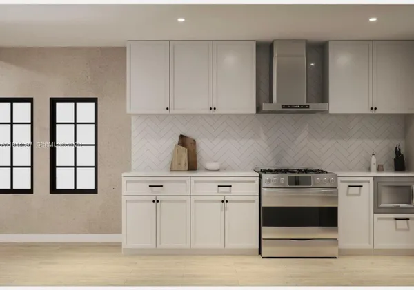 a kitchen with white cabinets and white appliances