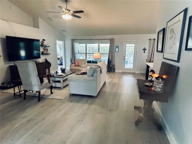 a room with a sink furniture and a mirror