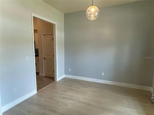 a bedroom with a bed and a table