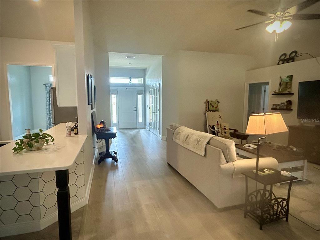 25 Northwest 45th Loop Ocala, FL 34475 - Photo 22 of 61 a living room with furniture and a table