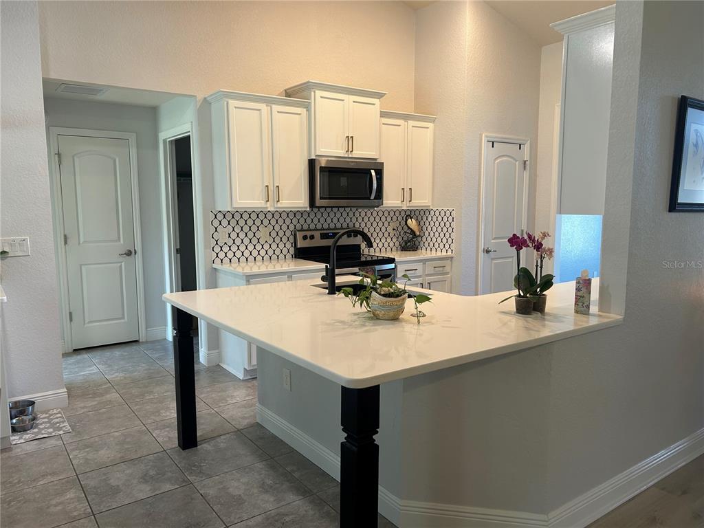 25 Northwest 45th Loop Ocala, FL 34475 - Photo 28 of 61 a room with a sink furniture and a mirror