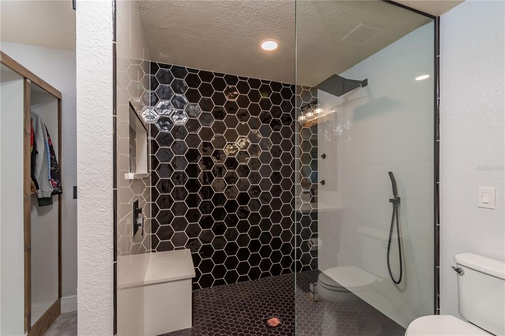 25 Northwest 45th Loop Ocala, FL 34475 - Photo 34 of 61 a bathroom with a shower toilet and sink