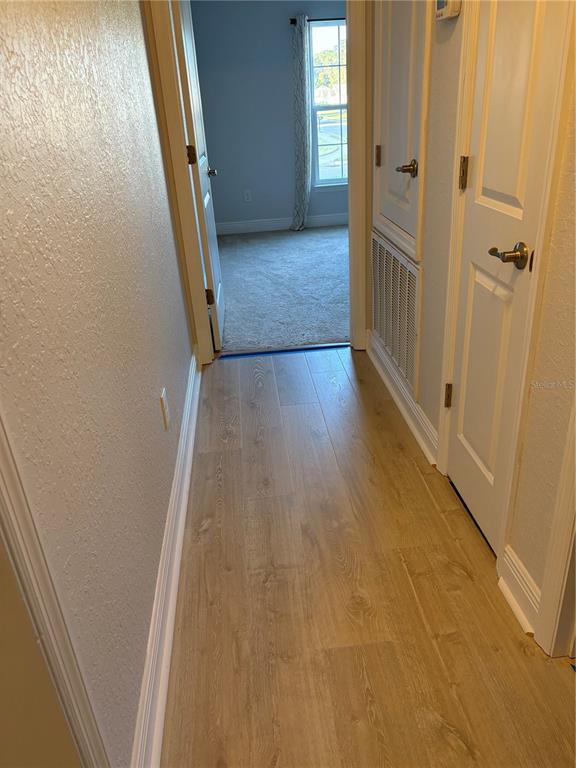 25 Northwest 45th Loop Ocala, FL 34475 - Photo 37 of 61 a view of hallway with wooden floor