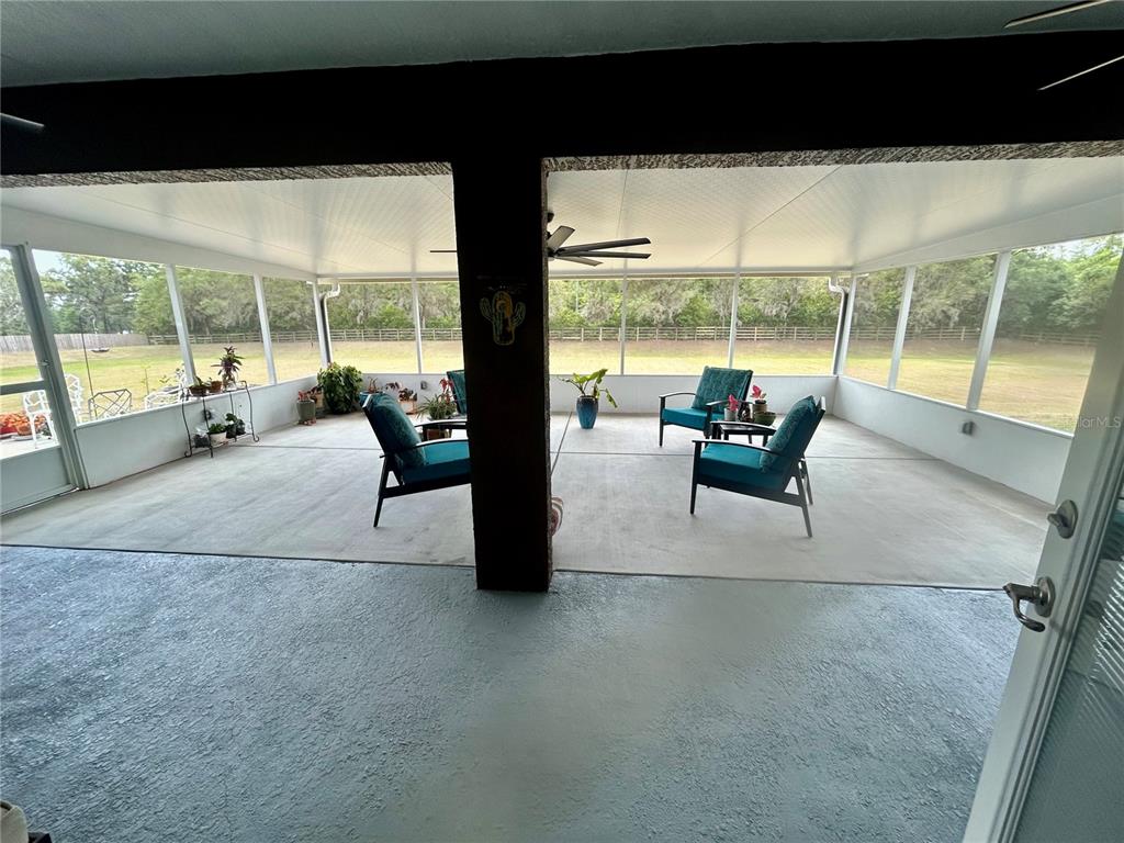 25 Northwest 45th Loop Ocala, FL 34475 - Photo 47 of 61 a living room with furniture and floor to ceiling windows