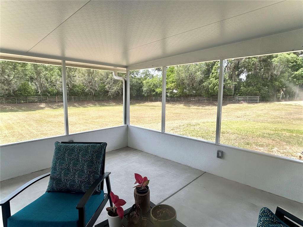 25 Northwest 45th Loop Ocala, FL 34475 - Photo 51 of 61 a living room with large windows
