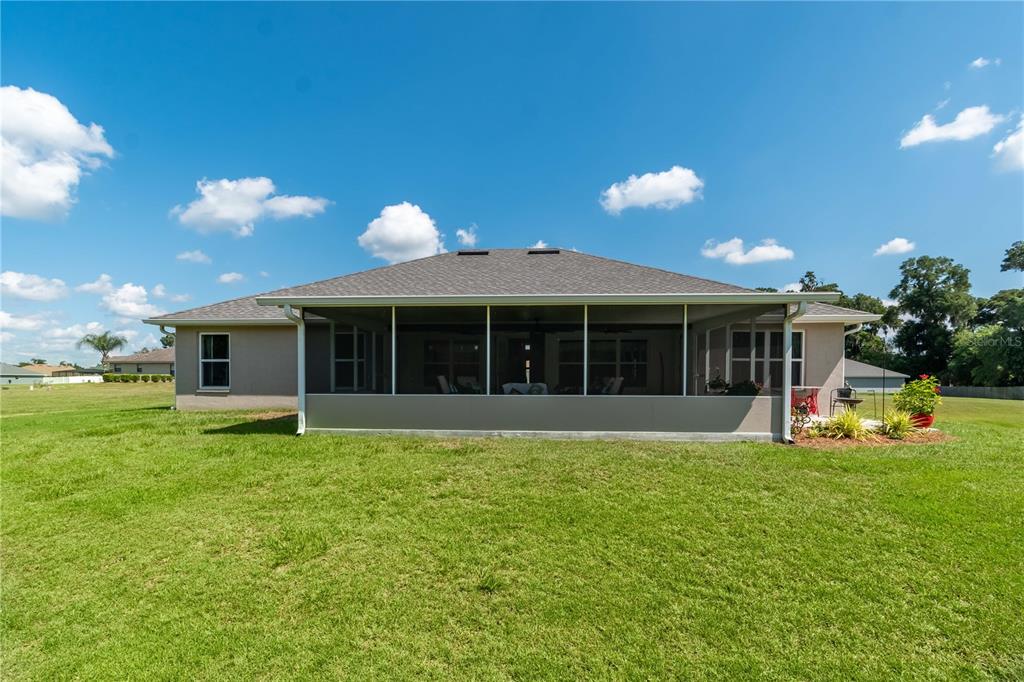 25 Northwest 45th Loop Ocala, FL 34475 - Photo 58 of 61 a view of a house with a yard and sitting area