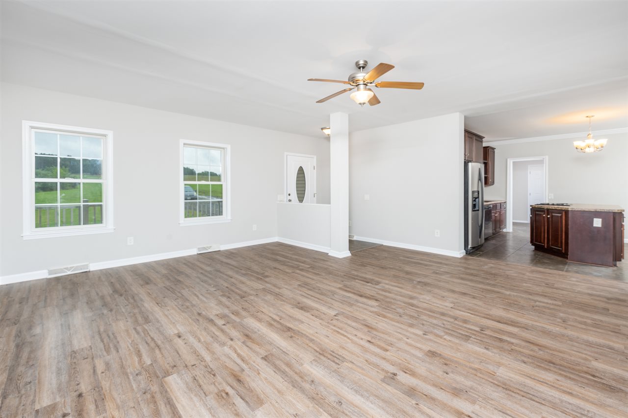 561 Rife's Ford Road Verona, VA 24482 - Photo 15 of 50 a view of an empty room with window and wooden floor