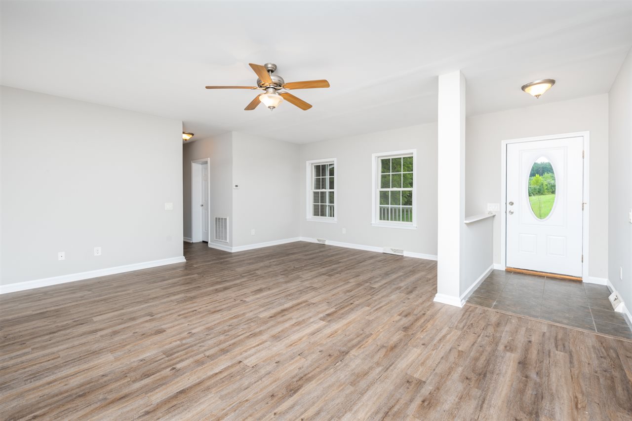 561 Rife's Ford Road Verona, VA 24482 - Photo 17 of 50 a view of an empty room with window and wooden floor