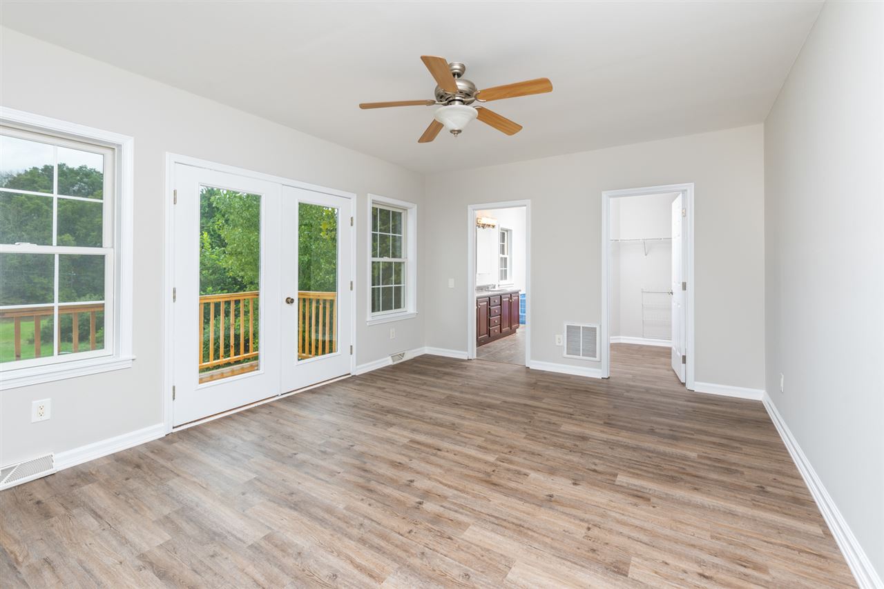561 Rife's Ford Road Verona, VA 24482 - Photo 20 of 50 a view of an empty room with a window and wooden floor