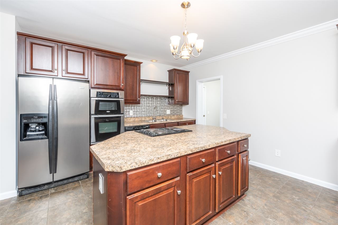 561 Rife's Ford Road Verona, VA 24482 - Photo 23 of 50 a kitchen with stainless steel appliances granite countertop a sink refrigerator and cabinets