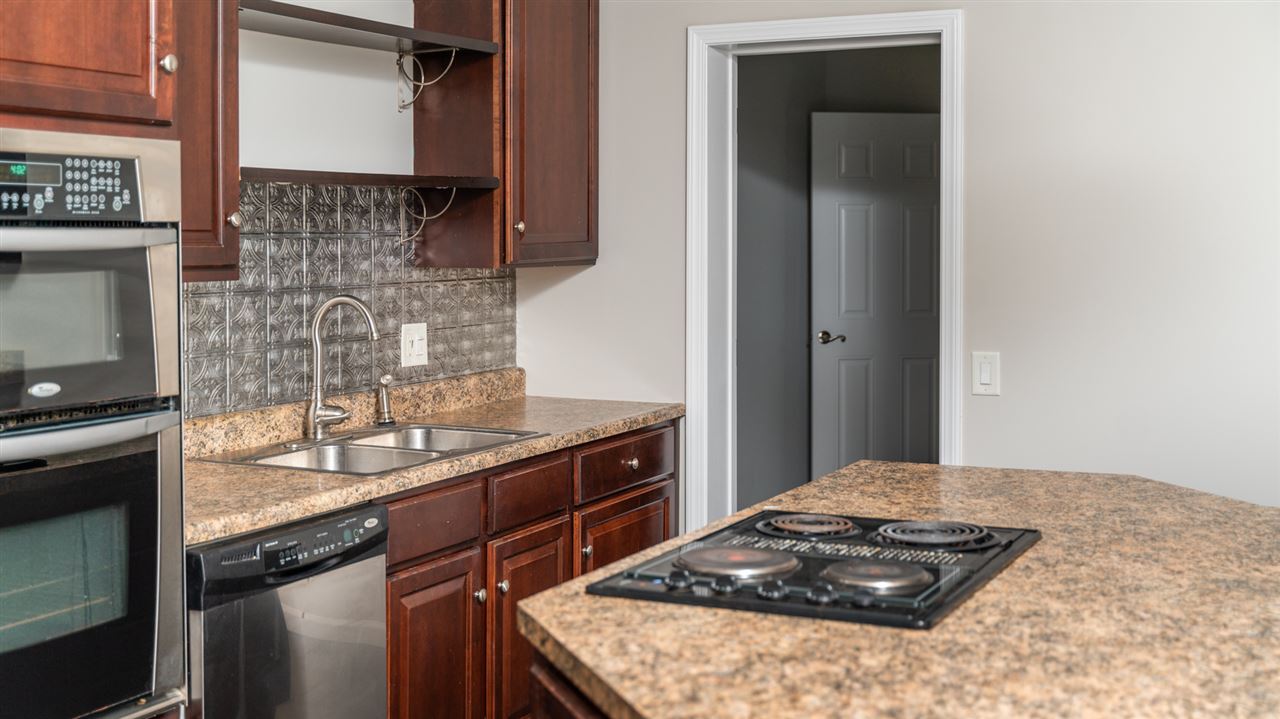 561 Rife's Ford Road Verona, VA 24482 - Photo 26 of 50 a kitchen with a sink stove and cabinets