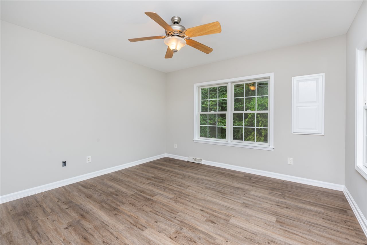 561 Rife's Ford Road Verona, VA 24482 - Photo 33 of 50 an empty room with wooden floor and windows