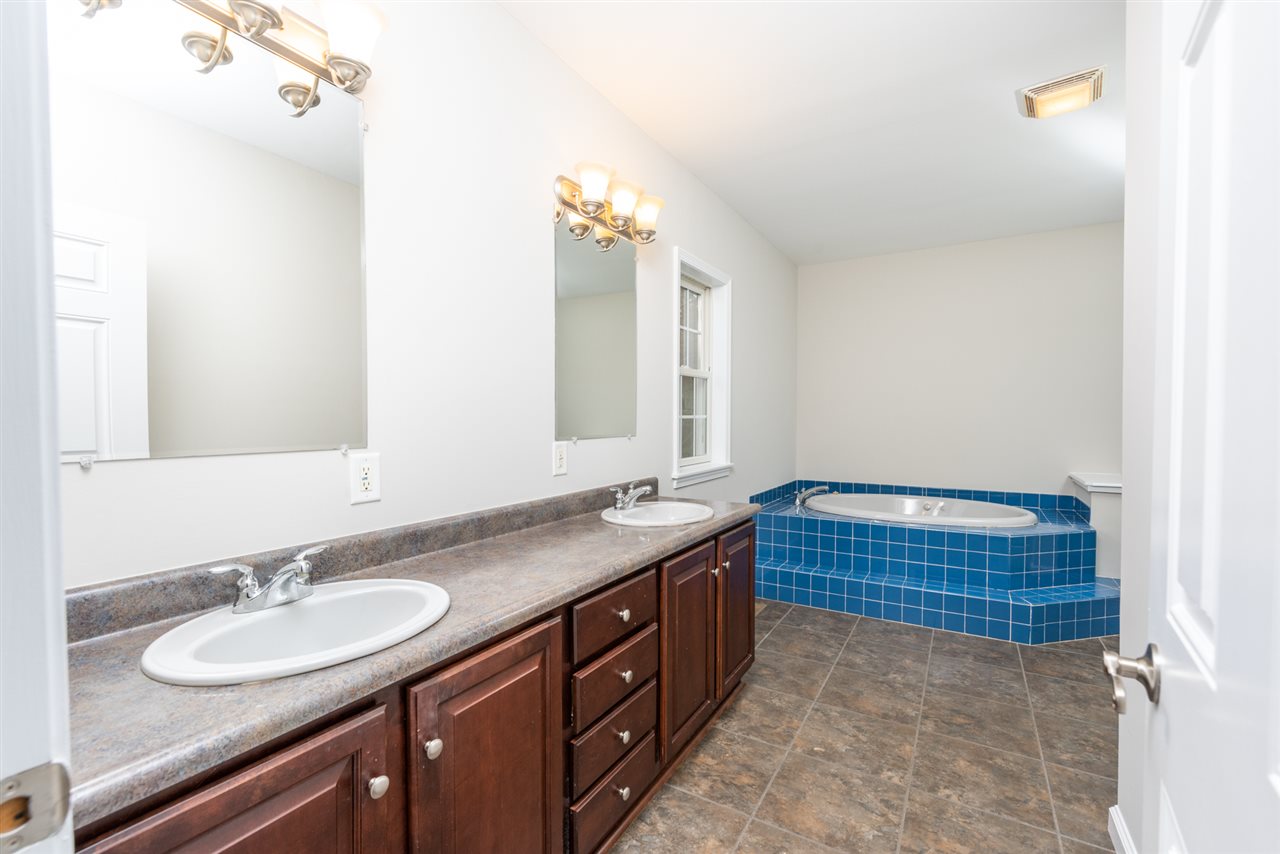 561 Rife's Ford Road Verona, VA 24482 - Photo 35 of 50 a bathroom with a sink double vanity granite and a mirror