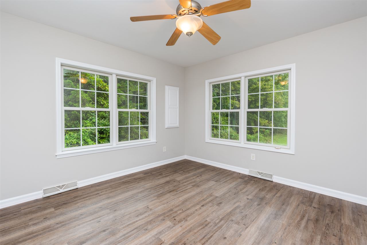 561 Rife's Ford Road Verona, VA 24482 - Photo 42 of 50 an empty room with wooden floor and windows