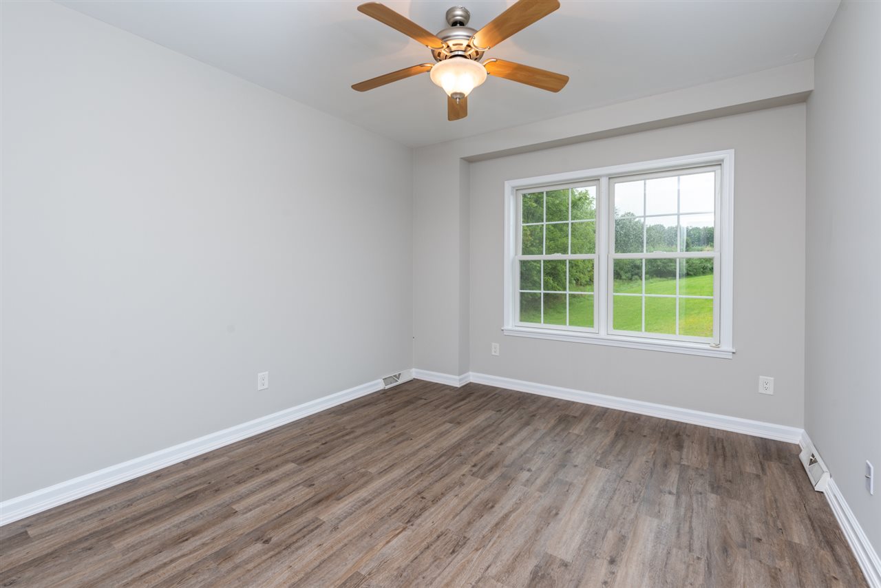 561 Rife's Ford Road Verona, VA 24482 - Photo 43 of 50 a view of a room with wooden floor and a ceiling fan