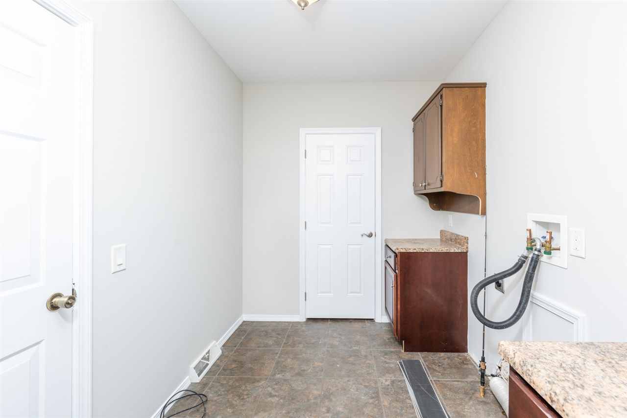 561 Rife's Ford Road Verona, VA 24482 - Photo 46 of 50 a bathroom with a granite countertop sink and a mirror