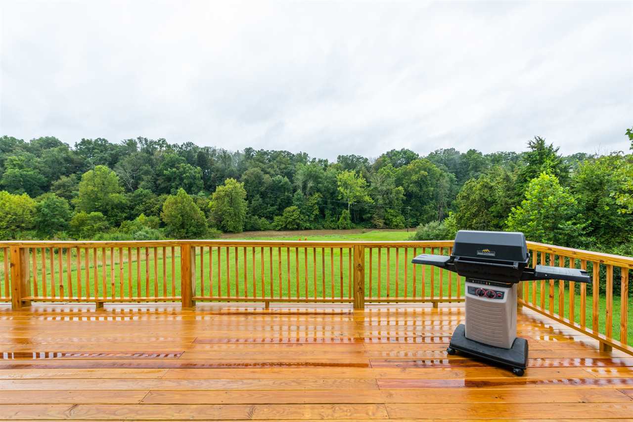561 Rife's Ford Road Verona, VA 24482 - Photo 8 of 50 a view of a deck with a floor to ceiling window next to a yard