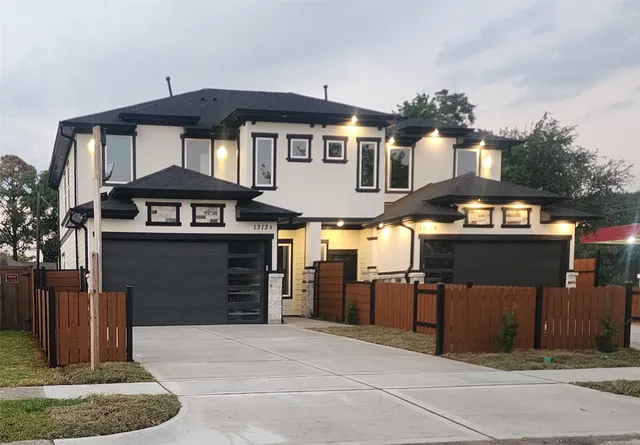 a front view of a house with parking