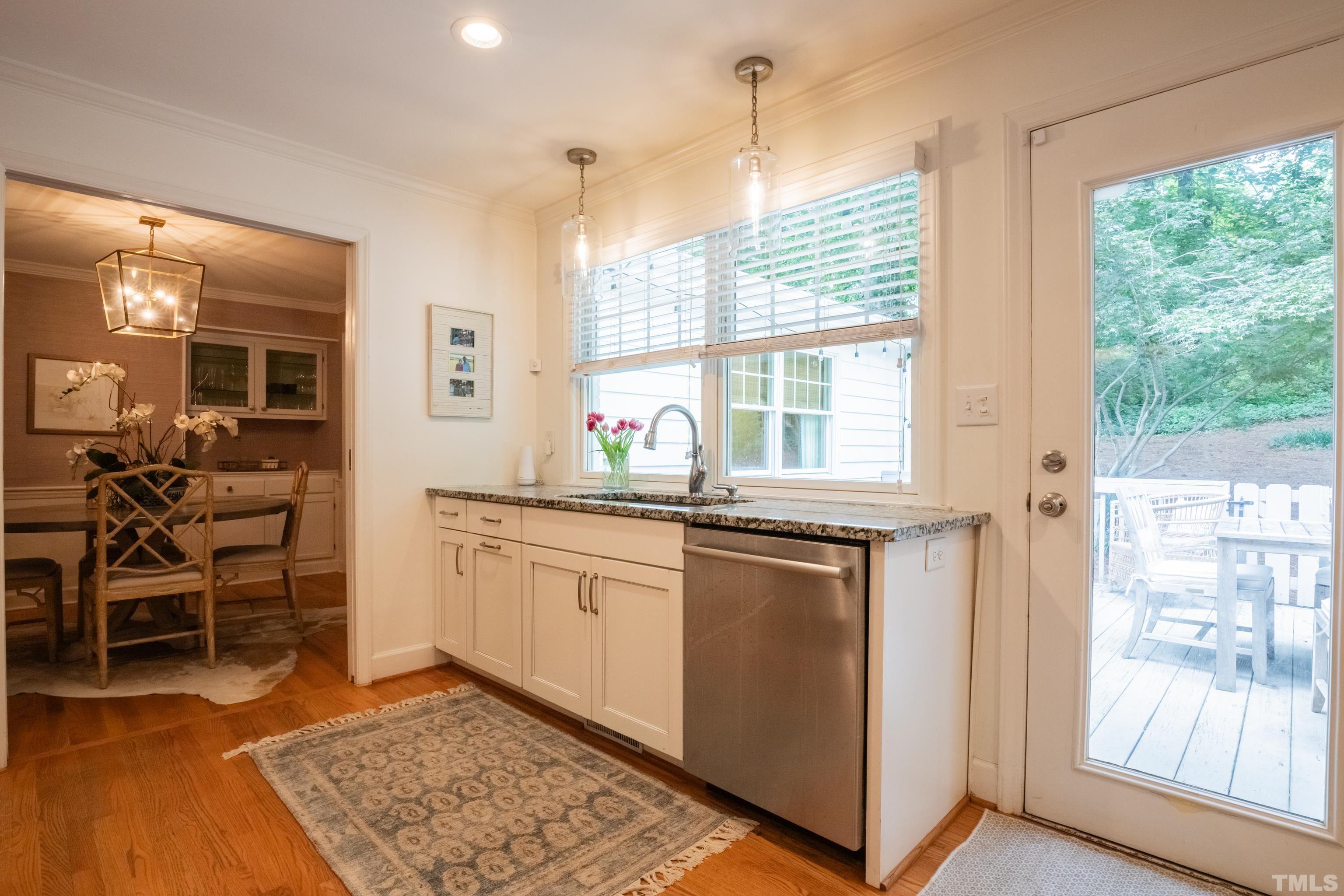 816 Davidson Street Raleigh, NC 27609 - Photo 12 of 36 a kitchen with stainless steel appliances granite countertop a stove a sink and a refrigerator