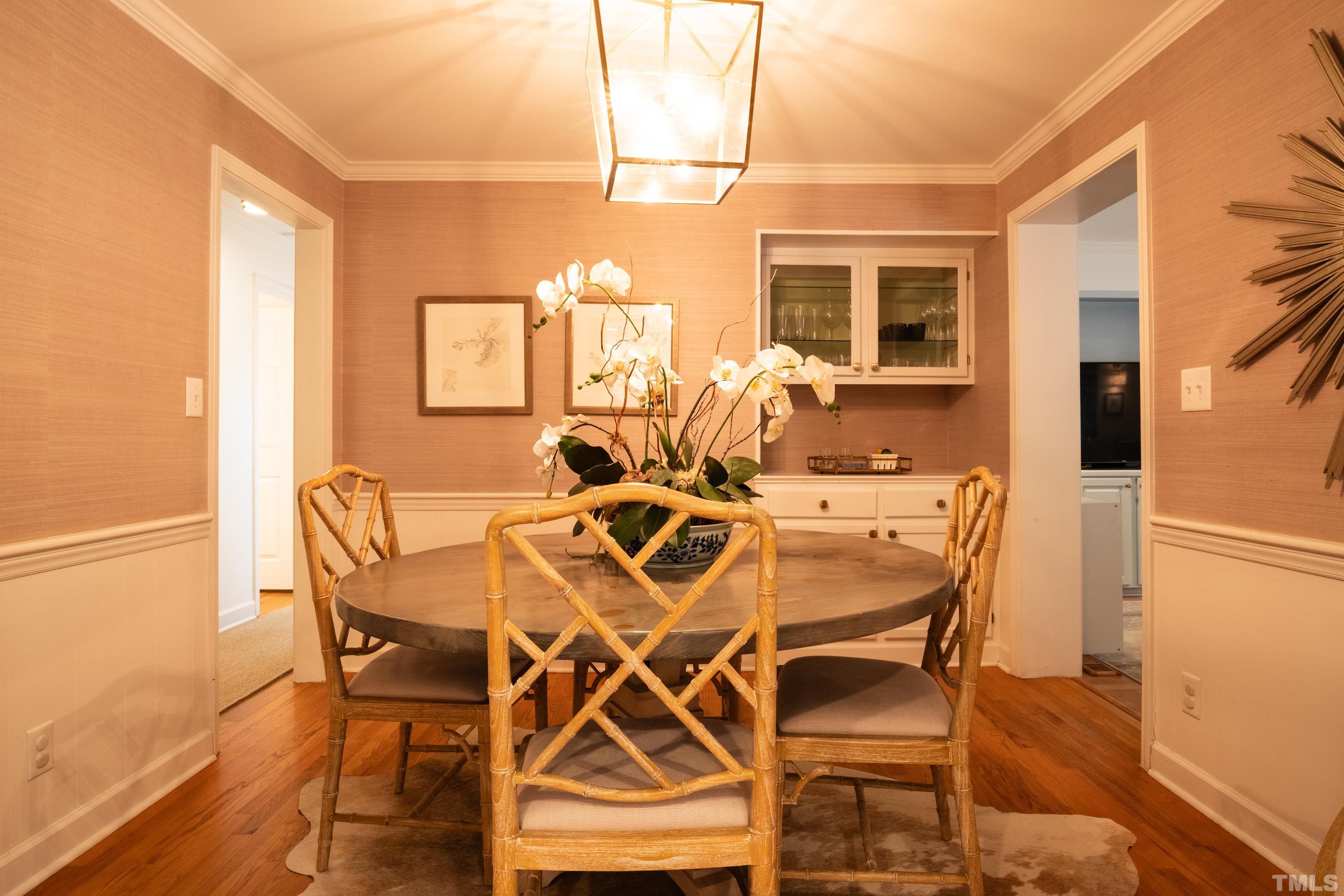 816 Davidson Street Raleigh, NC 27609 - Photo 15 of 36 a view of a dining room with furniture and a window