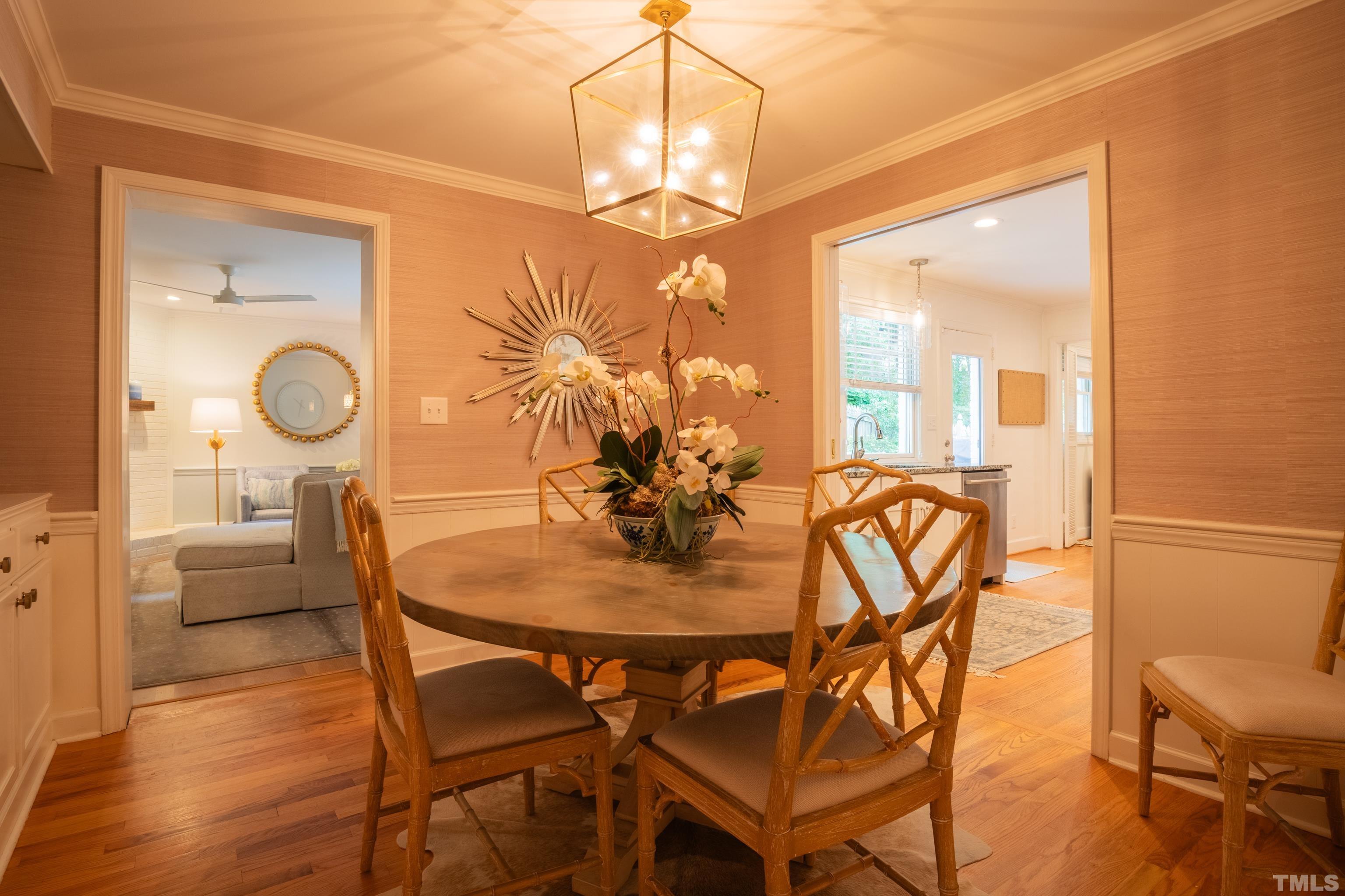 816 Davidson Street Raleigh, NC 27609 - Photo 16 of 36 a view of a dining room with furniture and wooden floor