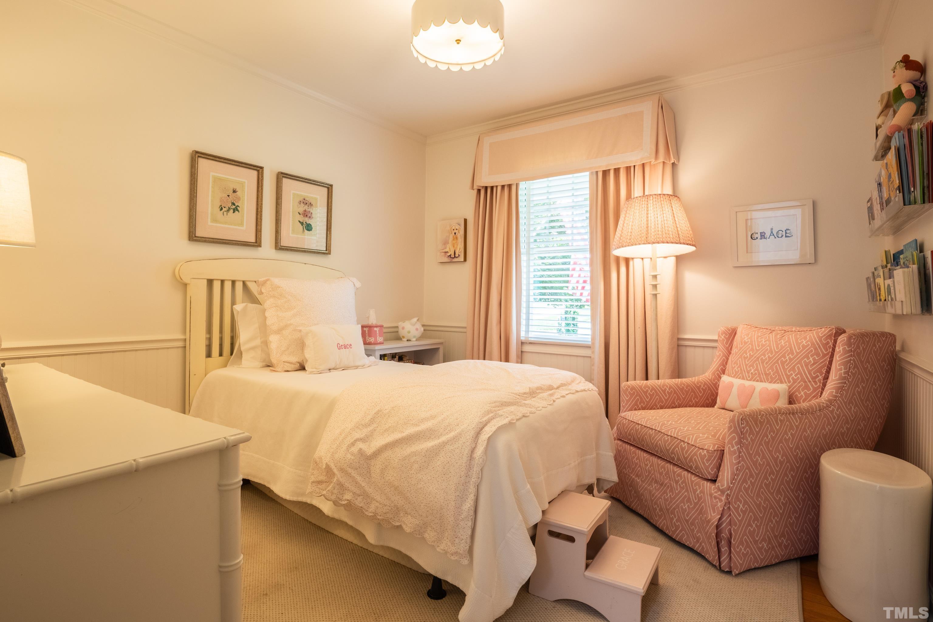 816 Davidson Street Raleigh, NC 27609 - Photo 21 of 36 a bedroom with a bed and a couch