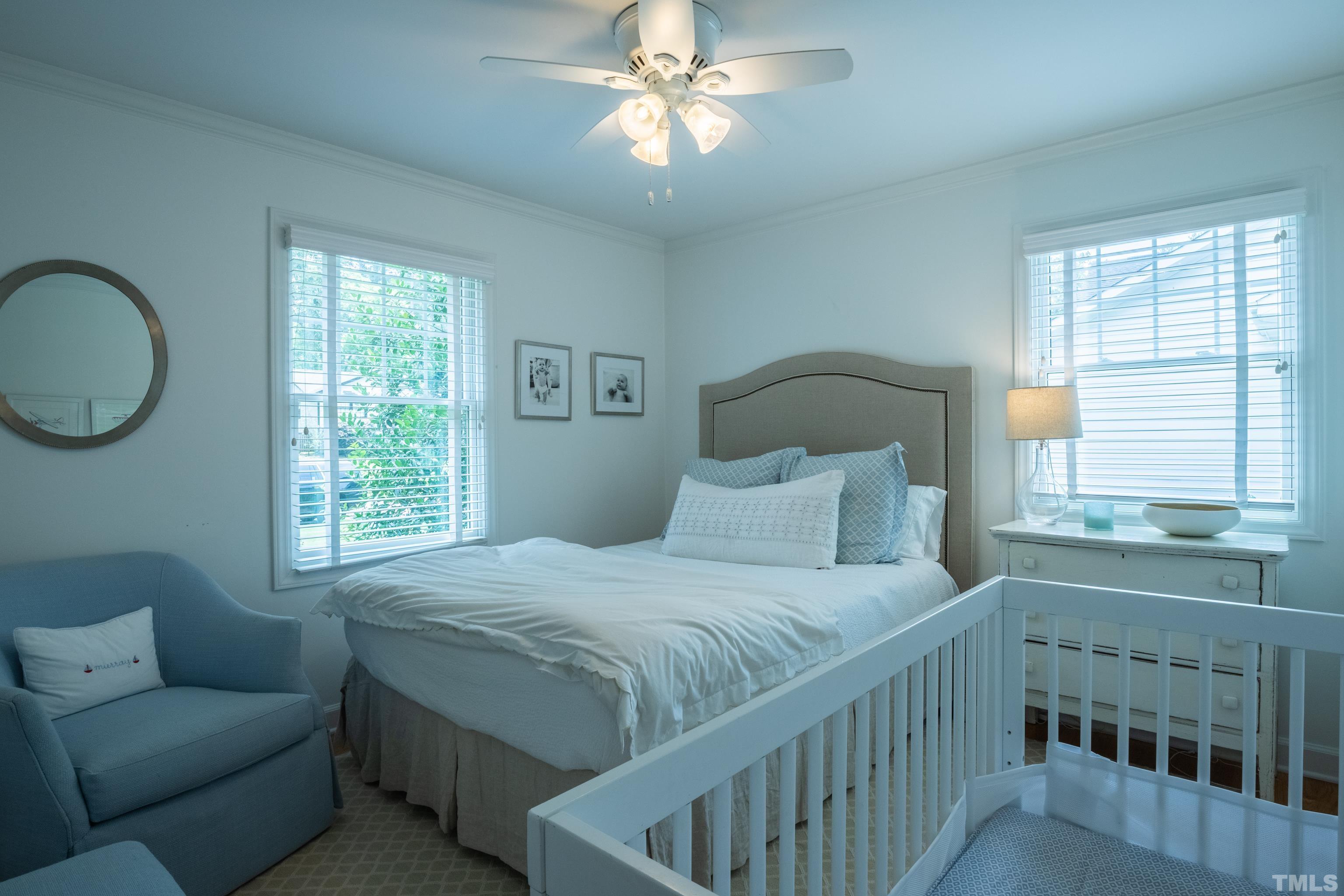 816 Davidson Street Raleigh, NC 27609 - Photo 24 of 36 a bedroom with a bed furniture and a window