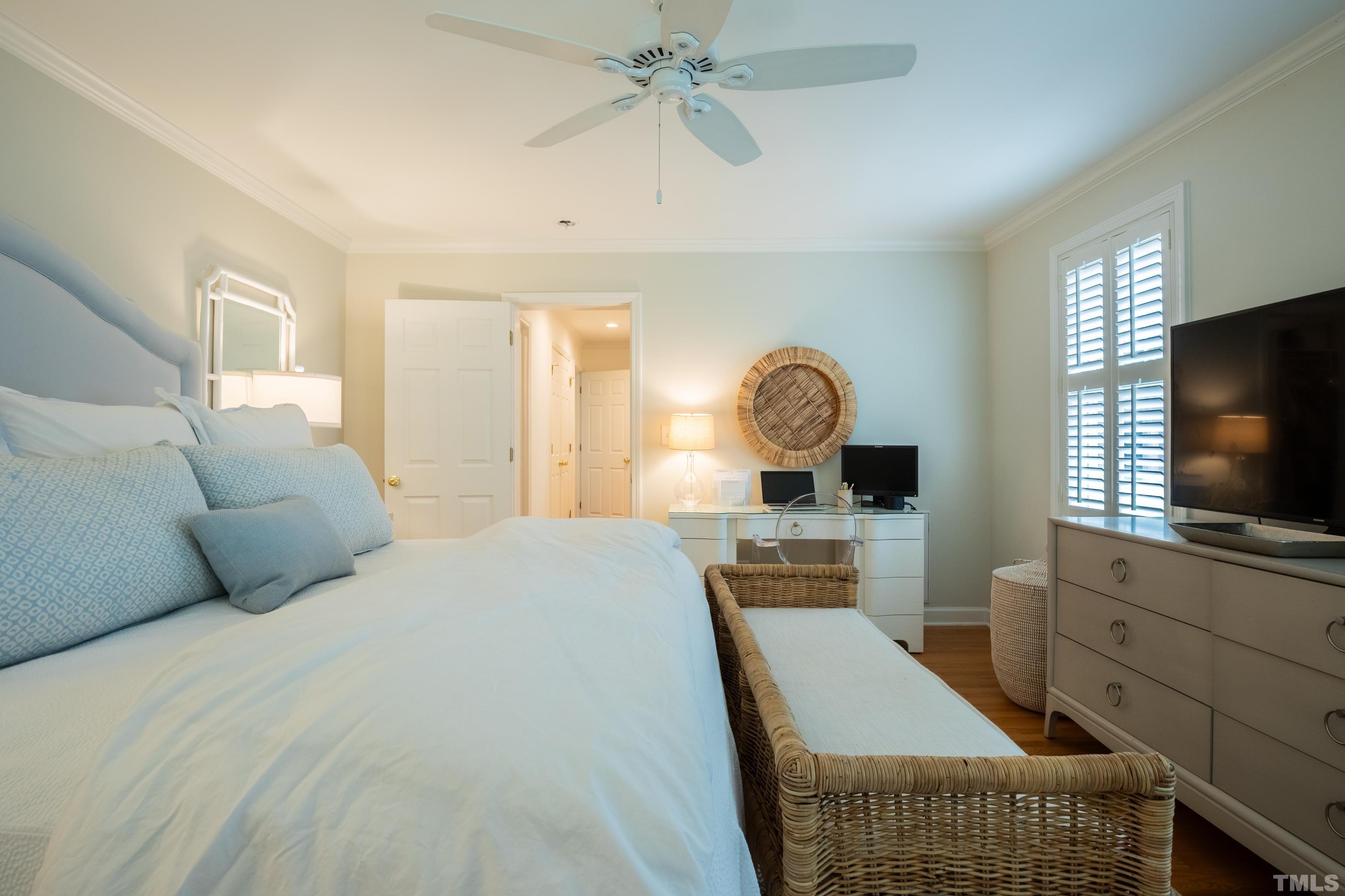 816 Davidson Street Raleigh, NC 27609 - Photo 26 of 36 a bedroom with furniture and a flat screen tv