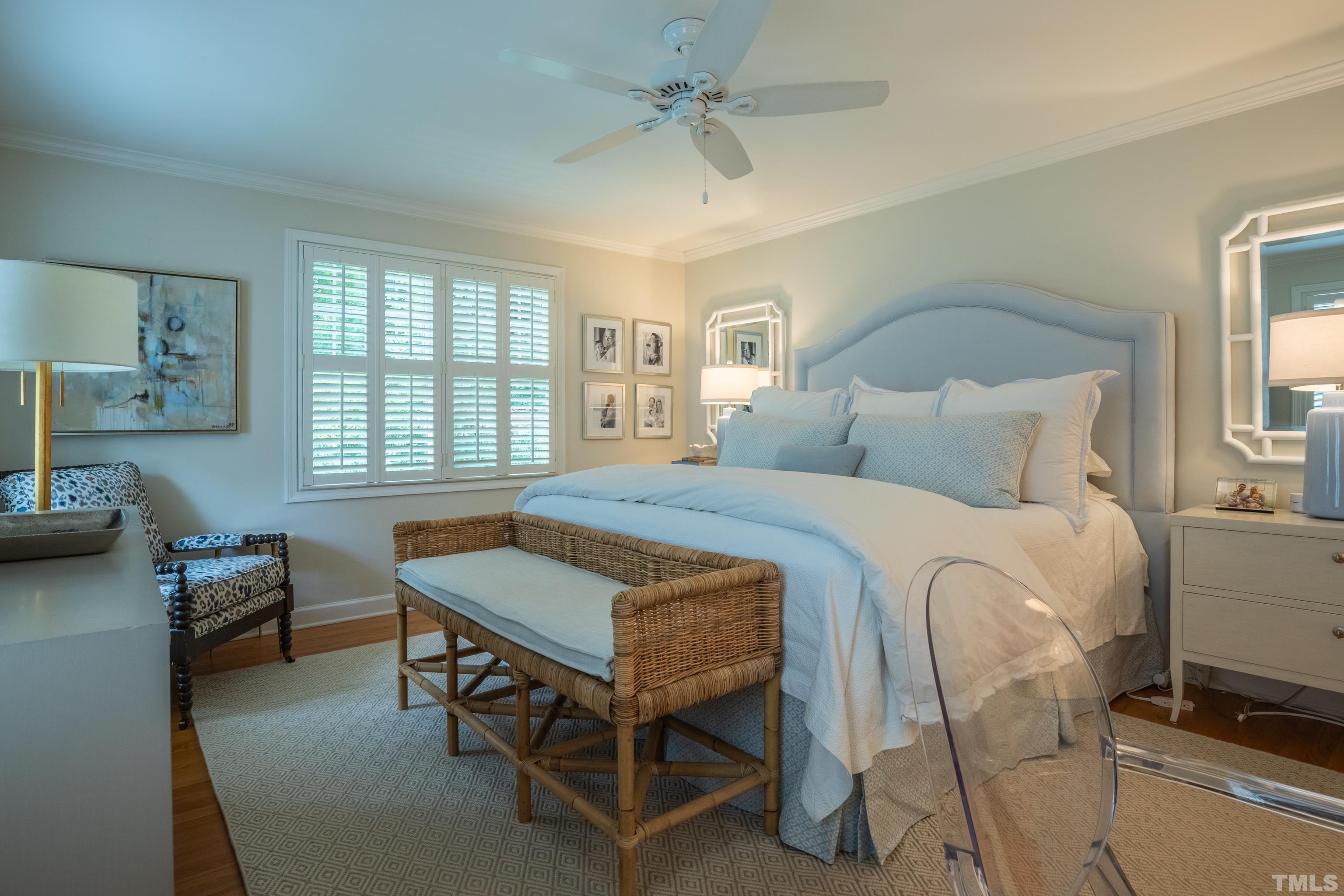 816 Davidson Street Raleigh, NC 27609 - Photo 27 of 36 a bedroom with a bed table chair and a window
