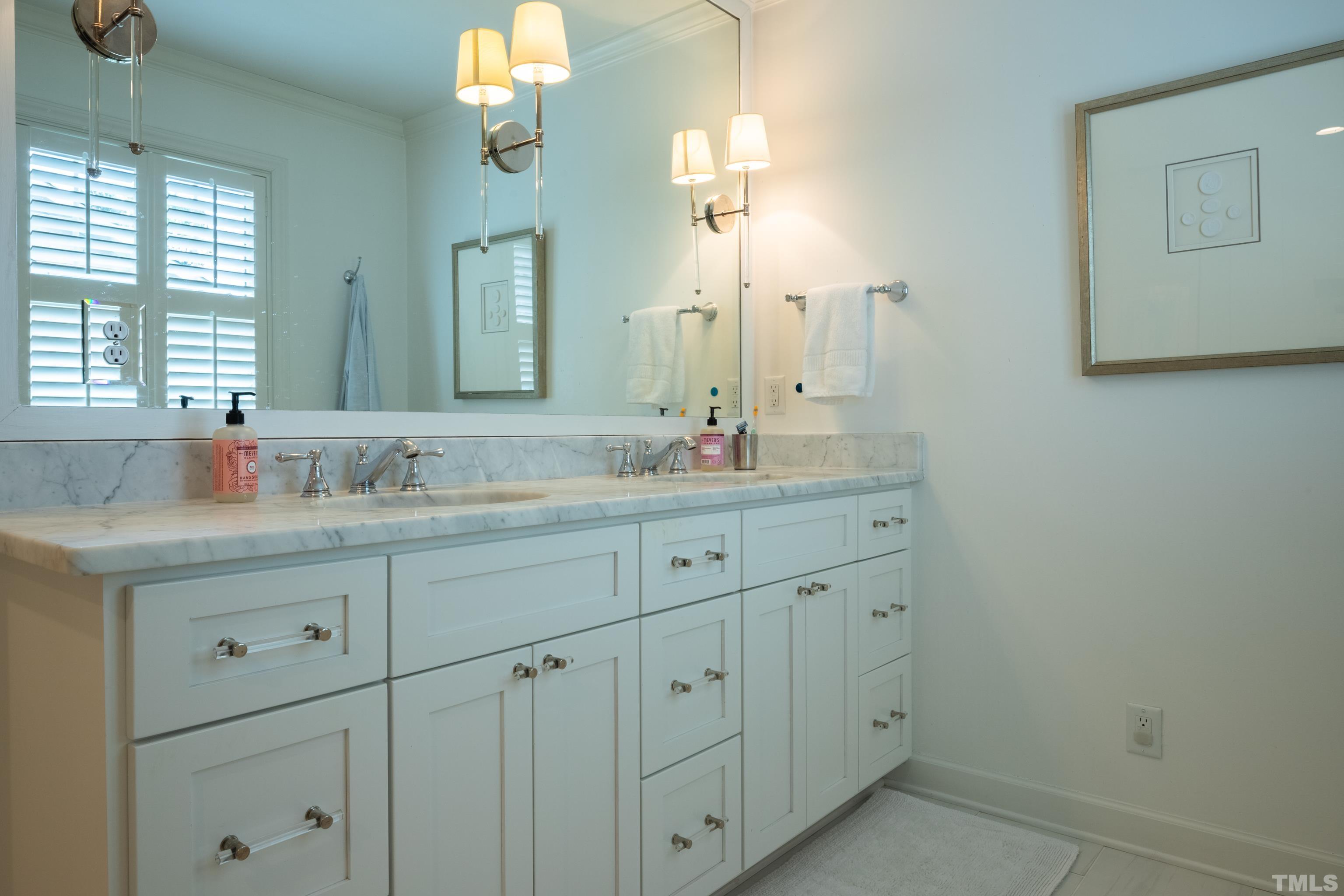 816 Davidson Street Raleigh, NC 27609 - Photo 30 of 36 a bathroom with double sink and a mirror