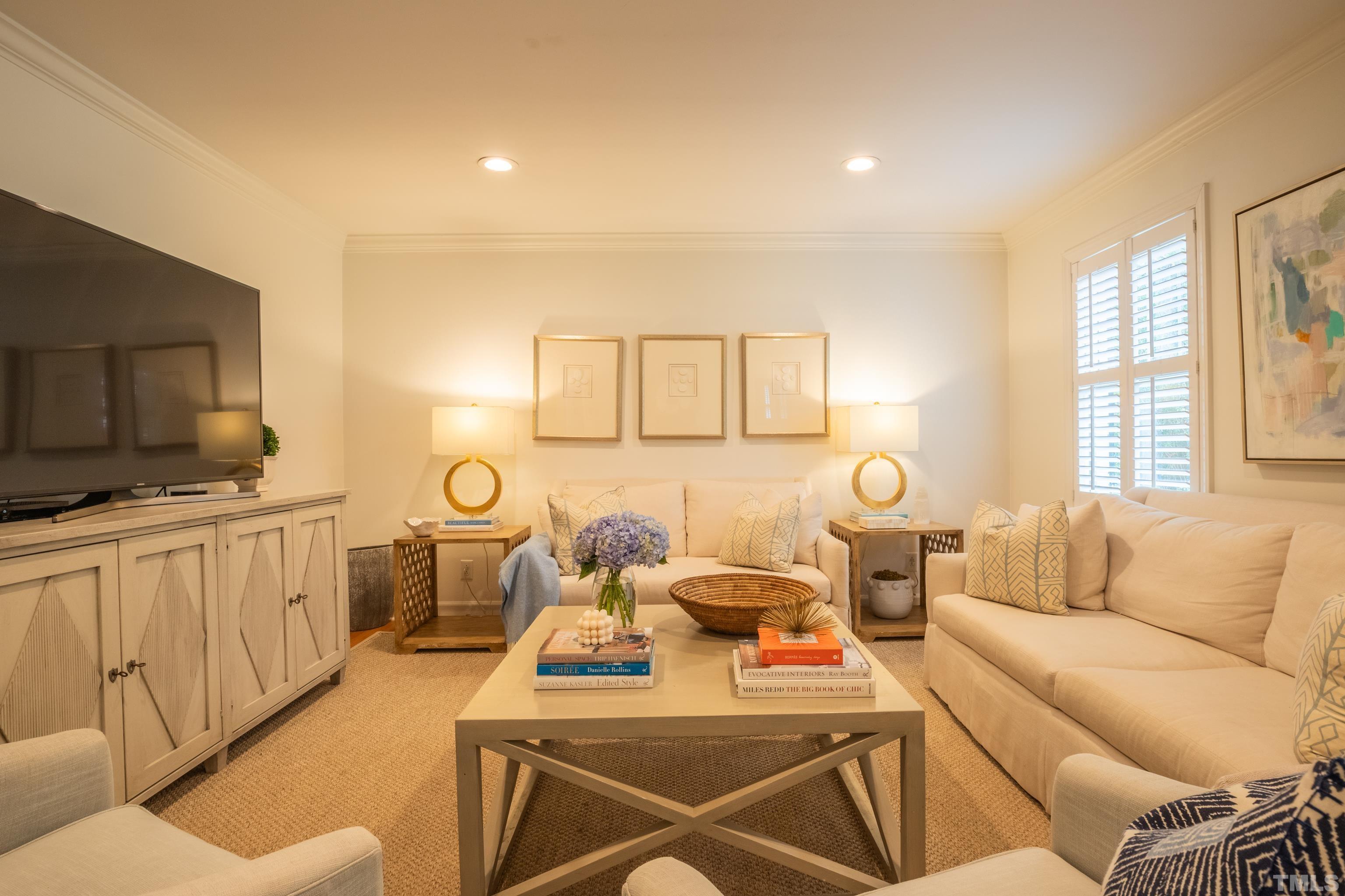 816 Davidson Street Raleigh, NC 27609 - Photo 5 of 36 a living room with furniture a flat screen tv and a window